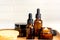 Natural skincare products in glass bottles. Serum and cream for facial skin. Herbal mineral cosmetic, vitamin body oil on wooden