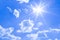 Natural sky background and radiating rays in a blue sky with clouds. That suitable for background, backdrop, wallpaper, display an