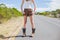 Natural slim woman posing while hitchhiking