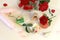 Natural soap, sea salt, buds, petals, red roses, shells and stones on the table