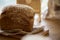 Natural sourdough unleavened bread on rustic sackling. Loaf of freshly baked bread with sesame. Beige food background.