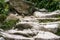 Natural stairs in mountains. Outdoor pathway in Tatra Mountains. Stairs made on stone. Mountains valley