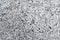 Natural stone gray granite background with untreated surface hard rock texture