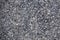 Natural stone grey granite background. Facing material granite texture. Grey granitic background texture. Hard gray granite rock t