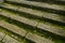 Natural stone stairs covered with algae in the surf