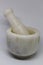 A natural stone white Marble Mortar and pestle set on a white background.
