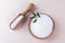 Natural sweetener in a wooden bowl on a pink background. Sugar substitute. Erythritol.