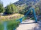 Natural swimming pool with blue toboggan in the Araxes river located in the Navarrese town of Betelu. Spain