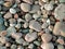 A natural texture made of different colour granite pebbels on The Baltic sea beach.