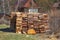 Natural texture of woodpile from coniferous trees. Pine firewood stacked on top of each other farm. Preparation of