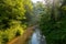 Natural Tuscan landscape with a river in the wood, at early morning in June 2019, Italy