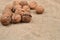 Natural, unbroken nuts on a jute bag background. Selective focus