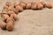 Natural, unbroken nuts on a jute bag background. Selective focus