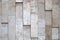 Natural uneven stone wall texture of beige scale colors porous material