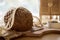 Natural unleavened buckwheat bread with sunflower seeds in eco mesh on wooden cutting board. Sourdough bread with