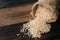 Natural unpolished brown rice on wooden table. healthy food and eating concept