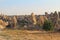 Natural valley with volcanic tuff stone rocks in Goreme in Cappadocia, Turkey, at sunset.