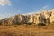 Natural valley with volcanic tuff stone rocks in Goreme in Cappadocia, Turkey, at sunset.