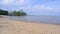 Natural View Of The Coast With Yellow Sand And Low Tide