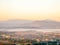 Natural viewpoint, mountains, hills, forests and river under morning mist