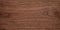 Natural walnut grain with beautiful wood grain. Walnut long planks texture. Walnut wood texture background.