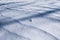 Natural wave-like ornament made by a blizzard on the snowy ground.