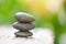 Natural wellness concept - Relax zen stones stack on wooden nature green background Spa Natural Alternative Therapy With Massage