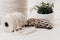 Natural White and Brown Macrame Cord on soft white blanket with plant