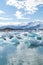 Natural wonder of Iceland. Amazing view of Icebergs and ice floes floating in a large Jokulsarlon glacier lagoon