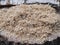 Natural wood sawdust after processing lumber closeup. Wood chips, shavings with birch bark