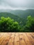 Natural Wood Table Mockup: Serene Summer Rain over Green Landscape