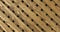 Natural wooden lattice on a black background. Zoom.