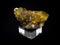 Natural yellow fluorite mineral on black background