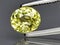 natural yellow grossular garnet gem on the background