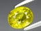 natural yellow grossular garnet gem on the background