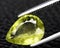 natural yellow grossular garnet gem on the background