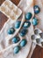 Naturally dyed cyan blue pressed flower Easter eggs.