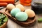 Naturally painted Easter eggs on wooden table, closeup. Spinach used for coloring