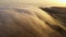 Nature amazing phenomenon of cloud surfing above mountains rock in desert. Magical moment above the clouds at sunrise