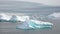 Nature of Antarctica. Icebergs against the background of mountains.Climate Change and Global Warming - Icebergs from