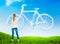 Nature background with a girl drawing bicycle