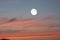 Nature background of shining full moon in dusk sky