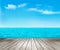 Nature background with a wooden deck, the sea and the sky.