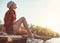 Only nature can cheer me up instantly. a happy young woman spending time by the lakeside.