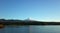 Nature of Chile, lake Villarrica and snow capped Villarrica volcano under blue sky evening light. Pucon