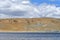 Nature-created image of Buddha`s eyes on the mountain on the shore of the sacred lake Manasarovar