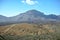 Nature in the desert, bush, mountains, islands, stones and bushes, plants under the scorching sun, red mountain, Teide park