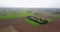 Nature and landscape: Aerial view of fields, trees and plowed fields, cultivation, green grass, dirt road
