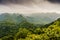 Nature landscape in Asia with dense trees and karst rocks. Ngu Lam Peak on Cat Ba Island, Vietnam