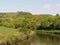 nature landscape on canal side with hill